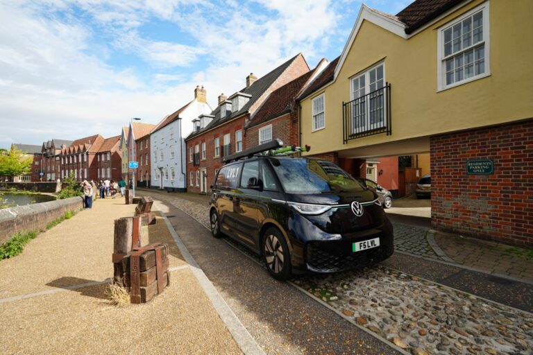 Black LVL1 Volkswagen ID. Buzz parked on a historic street in Norwich